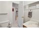 Bathroom showcasing a toilet, sink, and doorway with a view into an adjacent room at 3721 Conway Ave, Charlotte, NC 28209