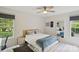 Bedroom featuring ceiling fan, natural light, and a decorative mirror at 3721 Conway Ave, Charlotte, NC 28209