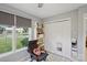 Bedroom corner featuring a book shelf, large window, and comfy rocking chair at 3721 Conway Ave, Charlotte, NC 28209