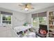 Light-filled bedroom featuring multiple windows and playful decor at 3721 Conway Ave, Charlotte, NC 28209
