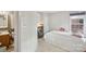 Comfortable bedroom featuring laundry amenities, storage, and an attached bathroom at 3721 Conway Ave, Charlotte, NC 28209