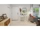 Inviting entryway with neutral walls, a mirror, and a decorative table and chair at 3721 Conway Ave, Charlotte, NC 28209