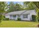 Charming single-story home with a well-maintained lawn, inviting porch, and attached garage at 3721 Conway Ave, Charlotte, NC 28209