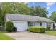 Inviting home featuring a well-kept lawn and a one-car garage at 3721 Conway Ave, Charlotte, NC 28209