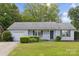 Charming home featuring a manicured lawn and attached garage at 3721 Conway Ave, Charlotte, NC 28209