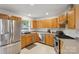 Well-equipped kitchen with stainless steel appliances, light-colored cabinets, and granite countertops at 3721 Conway Ave, Charlotte, NC 28209