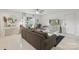 Bright living room with neutral tones, ceiling fan, large window, and view into dining area at 3721 Conway Ave, Charlotte, NC 28209