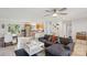 Open-concept living room, with neutral walls, a ceiling fan, and adjacent kitchen area at 3721 Conway Ave, Charlotte, NC 28209