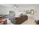 Open-concept living room, with neutral walls, a ceiling fan, and adjacent kitchen and dining areas at 3721 Conway Ave, Charlotte, NC 28209