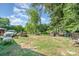 View of the expansive backyard with scattered items, showing potential for landscaping or recreation at 4059 10Th Avenue Sw Dr, Hickory, NC 28602