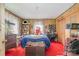 Bedroom showcasing a large bed, built-in storage, and red carpet at 4059 10Th Avenue Sw Dr, Hickory, NC 28602