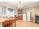 Bright dining area features a wooden table, wood floors and a classic chandelier at 4059 10Th Avenue Sw Dr, Hickory, NC 28602