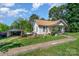 Traditional home featuring a detached garage, driveway, and mature trees at 4059 10Th Avenue Sw Dr, Hickory, NC 28602