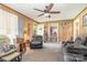 The living room features a fireplace, comfortable seating, and access to the outdoors at 4059 10Th Avenue Sw Dr, Hickory, NC 28602