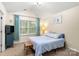 Comfortable bedroom featuring a large window, TV, and neutral décor at 424 River Park Rd, Belmont, NC 28012