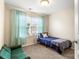 Cozy bedroom with neutral walls, soft carpet, and a comfortable twin bed beside a window at 424 River Park Rd, Belmont, NC 28012