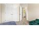 Bedroom with neutral walls, plush carpet, a closet, and doorway that leads to the bathroom at 424 River Park Rd, Belmont, NC 28012