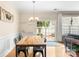 Cozy dining room with a modern table setting and a sliding glass door to the outdoor patio at 424 River Park Rd, Belmont, NC 28012