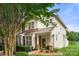Charming two-story home with well-maintained landscaping and inviting front porch at 424 River Park Rd, Belmont, NC 28012