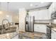 Updated kitchen boasts stainless steel appliances, granite countertops, and custom tile flooring at 424 River Park Rd, Belmont, NC 28012