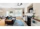 Bright and airy living room featuring a fireplace, built-in shelving, and a sliding door to the backyard at 424 River Park Rd, Belmont, NC 28012