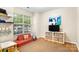 Cozy living room with hardwood floors, a large window, and stylish decor at 424 River Park Rd, Belmont, NC 28012