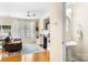 Comfortable living room featuring a fireplace, hardwood floors, and a half bathroom entrance at 424 River Park Rd, Belmont, NC 28012