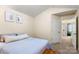 Bright bedroom with neutral walls, soft carpet, and a comfortable bed with a wooden bench at 424 River Park Rd, Belmont, NC 28012