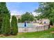 Community pool area with lounge chairs and umbrellas, perfect for relaxing and enjoying the outdoors at 424 River Park Rd, Belmont, NC 28012