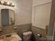 Standard bathroom with vanity, toilet, and window offering natural light at 4520 Bradbury Dr, Charlotte, NC 28209