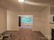 Open-concept living room with an adjacent dining room at 4520 Bradbury Dr, Charlotte, NC 28209