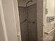 Enclosed shower with tiled walls, grab bar and shower head at 4520 Bradbury Dr, Charlotte, NC 28209