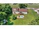 Aerial view of the backyard showcasing the in-ground pool, deck, and well-maintained lawn at 454 N Eastway Dr, Troutman, NC 28166