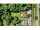 Beautiful aerial view of the property highlighting its spacious yard, pool, and mature trees at 454 N Eastway Dr, Troutman, NC 28166