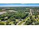 Aerial view of property showing proximity to the City of Troutman, neighborhood, and surrounding landscape at 454 N Eastway Dr, Troutman, NC 28166