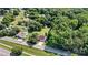 Expansive aerial view of the property showcasing the home, yard, pool, and surrounding trees at 454 N Eastway Dr, Troutman, NC 28166