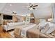 Spacious bedroom featuring a comfortable bed, a cozy lounge area, and plenty of natural light at 454 N Eastway Dr, Troutman, NC 28166