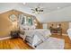 Cozy bedroom featuring hardwood floors, soft lighting, and a comfortable bed at 454 N Eastway Dr, Troutman, NC 28166