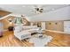 Spacious bedroom featuring hardwood floors, ample lighting, and a comfortable lounge area with stylish decor at 454 N Eastway Dr, Troutman, NC 28166