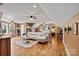 Expansive bedroom featuring hardwood floors, ample lighting, and a comfortable lounge area with stylish decor at 454 N Eastway Dr, Troutman, NC 28166