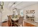 Dining room with rustic decor, modern light fixture, and hardwood floors at 454 N Eastway Dr, Troutman, NC 28166
