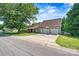 Charming exterior of a well-maintained home with a three-car garage and a basketball hoop at 454 N Eastway Dr, Troutman, NC 28166