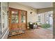 Inviting front porch featuring a double door entrance, stylish seating, and charming outdoor decor at 454 N Eastway Dr, Troutman, NC 28166