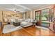 Comfortable living room with hardwood floors, plush sofa, decorative shelves, and an inviting atmosphere at 454 N Eastway Dr, Troutman, NC 28166