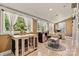 Inviting sunroom featuring large windows, tiled floors, and a charming play area at 454 N Eastway Dr, Troutman, NC 28166