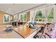 Bright sunroom boasting a built-in desk, windows, and a cozy seating area at 454 N Eastway Dr, Troutman, NC 28166