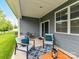 Cozy covered back porch with outdoor seating, perfect for enjoying the backyard at 505 Belle Grove Dr, Lake Wylie, SC 29710