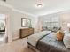 Inviting bedroom featuring carpet floors, two chairs, a large window, and neutral decor at 505 Belle Grove Dr, Lake Wylie, SC 29710