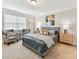 Comfortable bedroom featuring carpet floors, two chairs, a large window, and neutral decor at 505 Belle Grove Dr, Lake Wylie, SC 29710