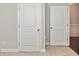 Closet and room doors in a carpeted hallway, offering convenient access and storage options at 505 Belle Grove Dr, Lake Wylie, SC 29710
